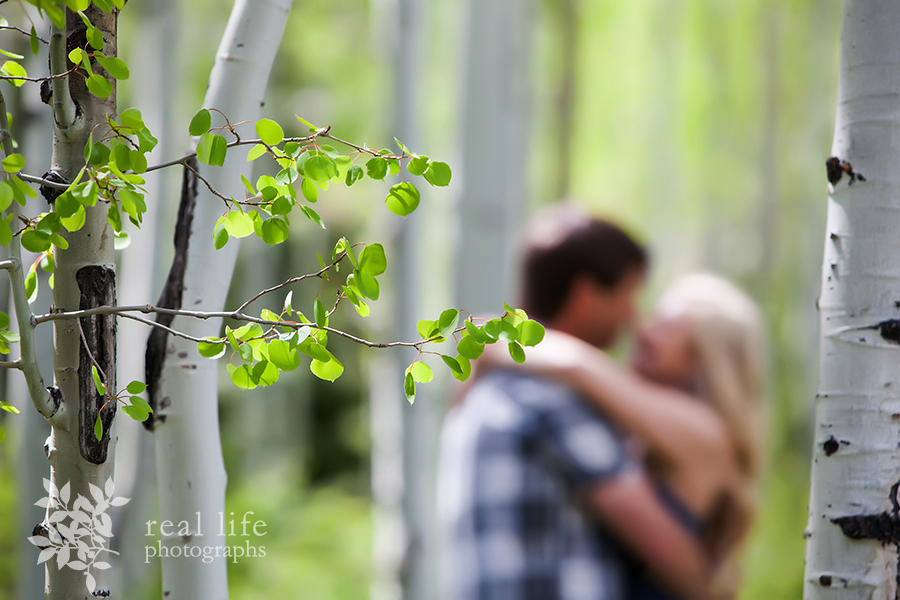 Shallow depth of field allows you to see the couple in the background embracing