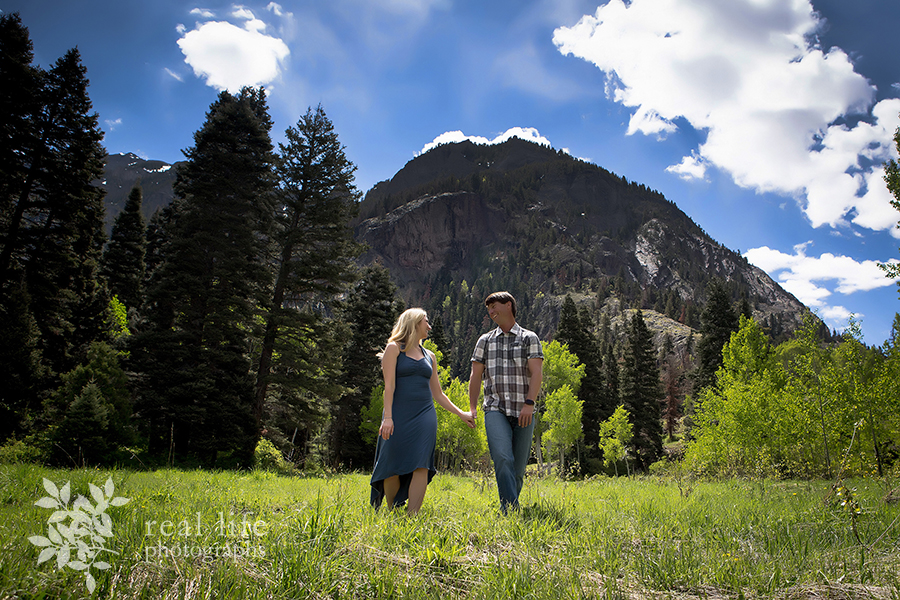 couple playfully loving and having fun in the mountains at a Ouray Colorado engagement session