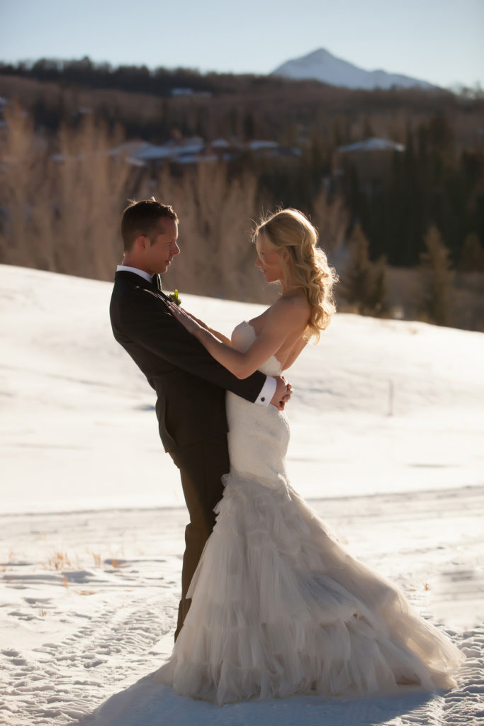 Couple gets married in winter at Gorrono Ranch. Their first look was at the Peaks hotel on the golf course in the snow