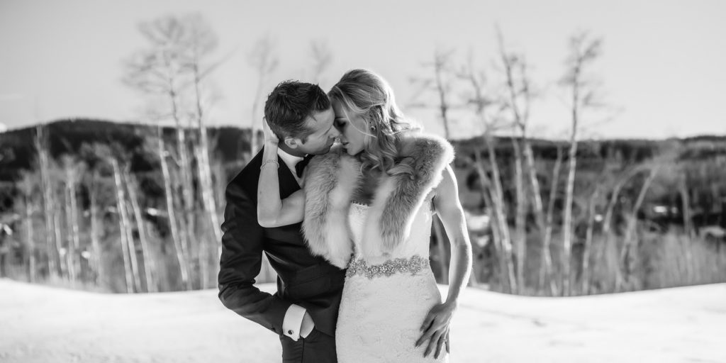 Couple gets married in winter at Gorrono Ranch.  Their first look was at the Peaks hotel on the golf course in the snow