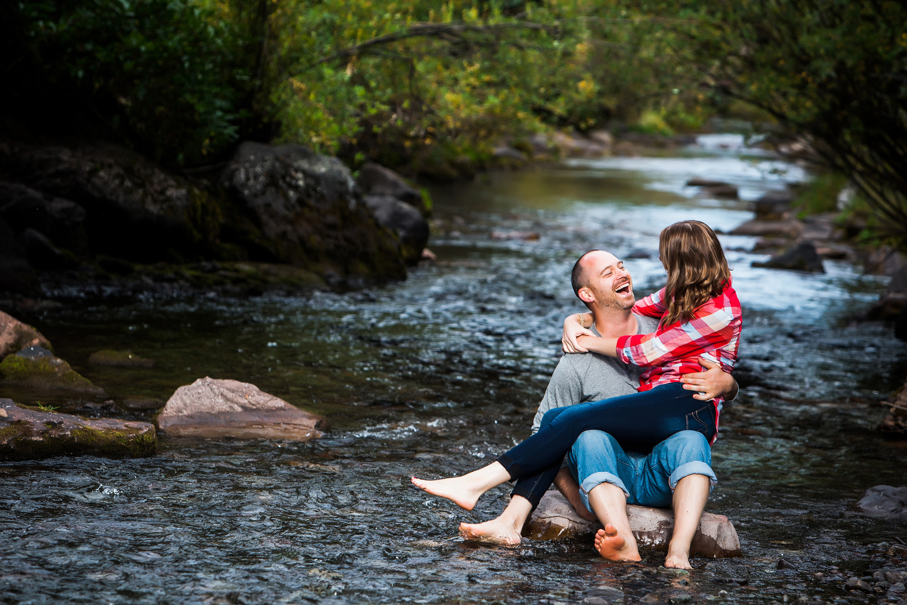 summer telluride engagement session in town park in the river 