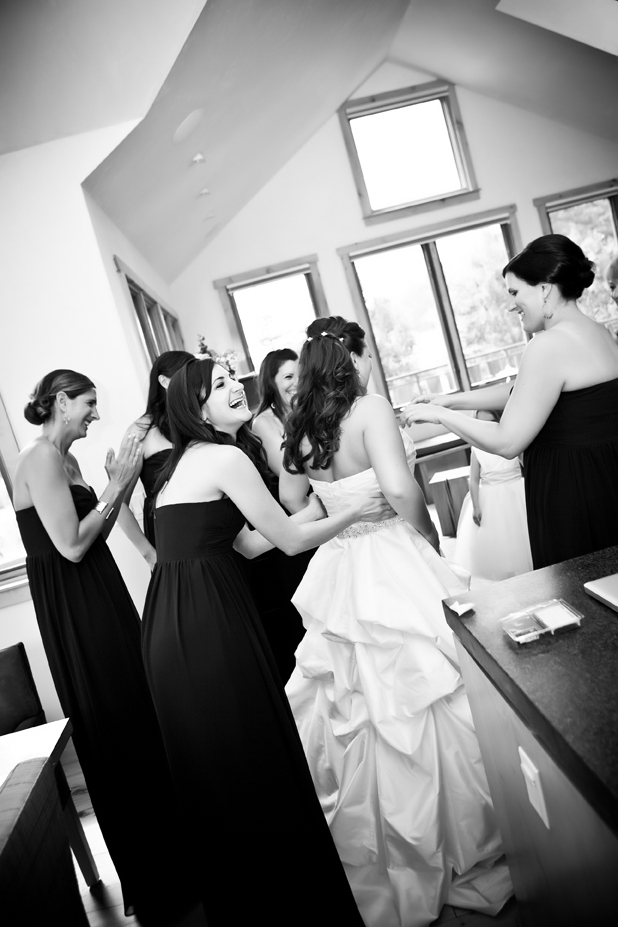 Getting dressed with her bridesmaids at the brides home in Telluride, Colorado.