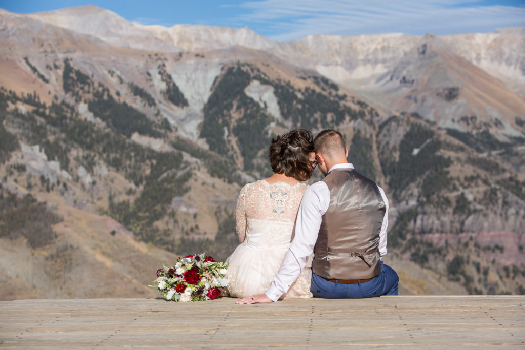 Couple sits on the deck at San Sophia Overlook