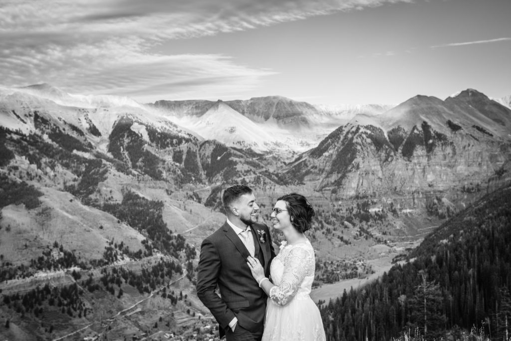 Black and white image of Couple eloping at San Sophia Overlook in Telluride Colorado photographed by Real Life Photographs