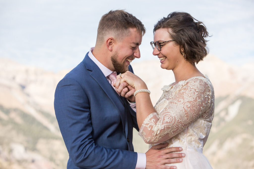 couple has fun with their elopement portrait session.  Giggles