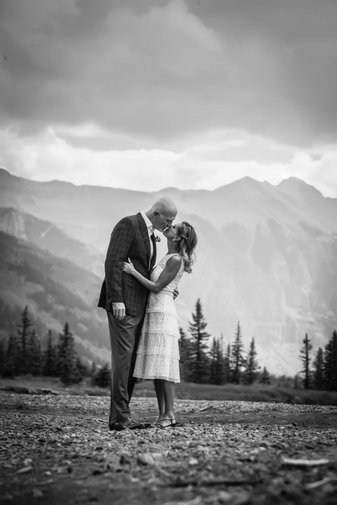 black and white image of the couple about to kiss on the valley floor.