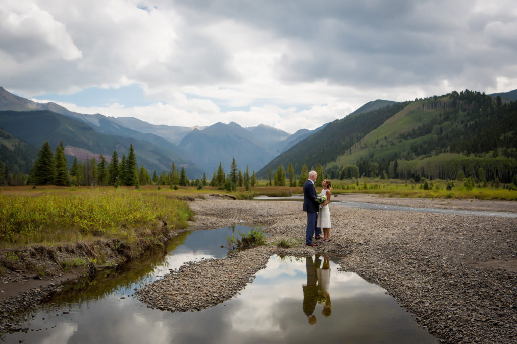 Reflection of the eloped couple in Telluride as rain drops start to fall.
