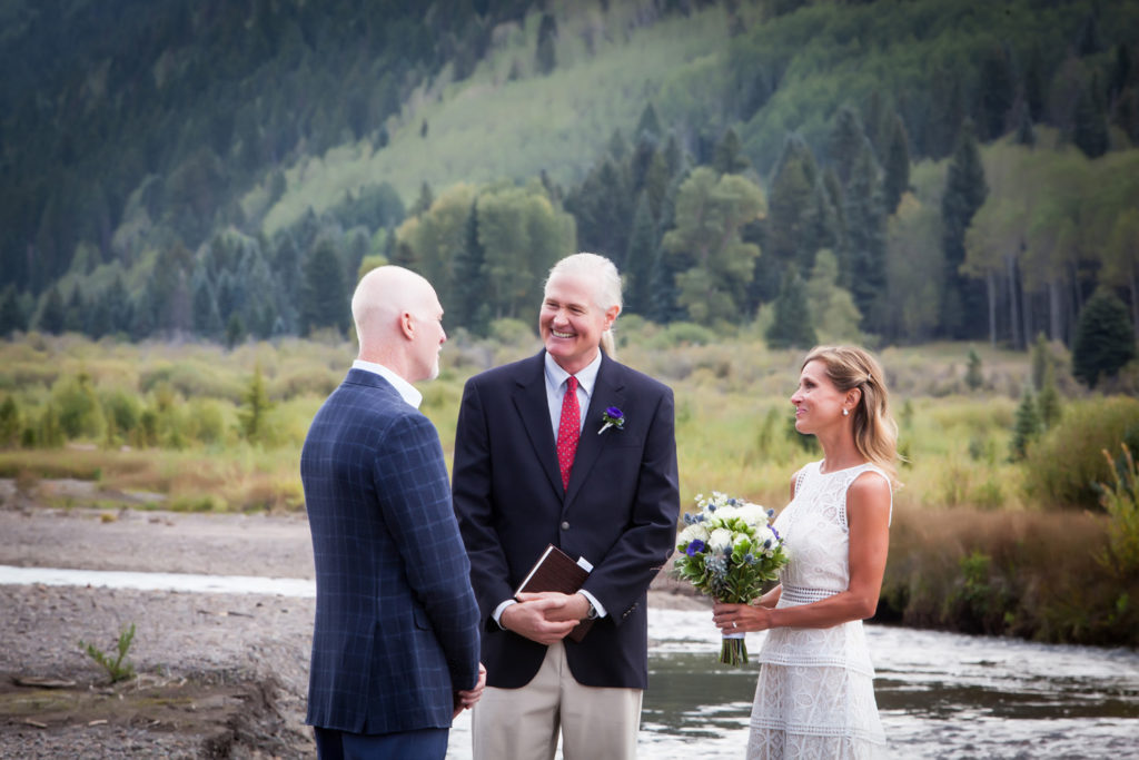 Couple shares their vows with Ashley the officiant on the valley floor