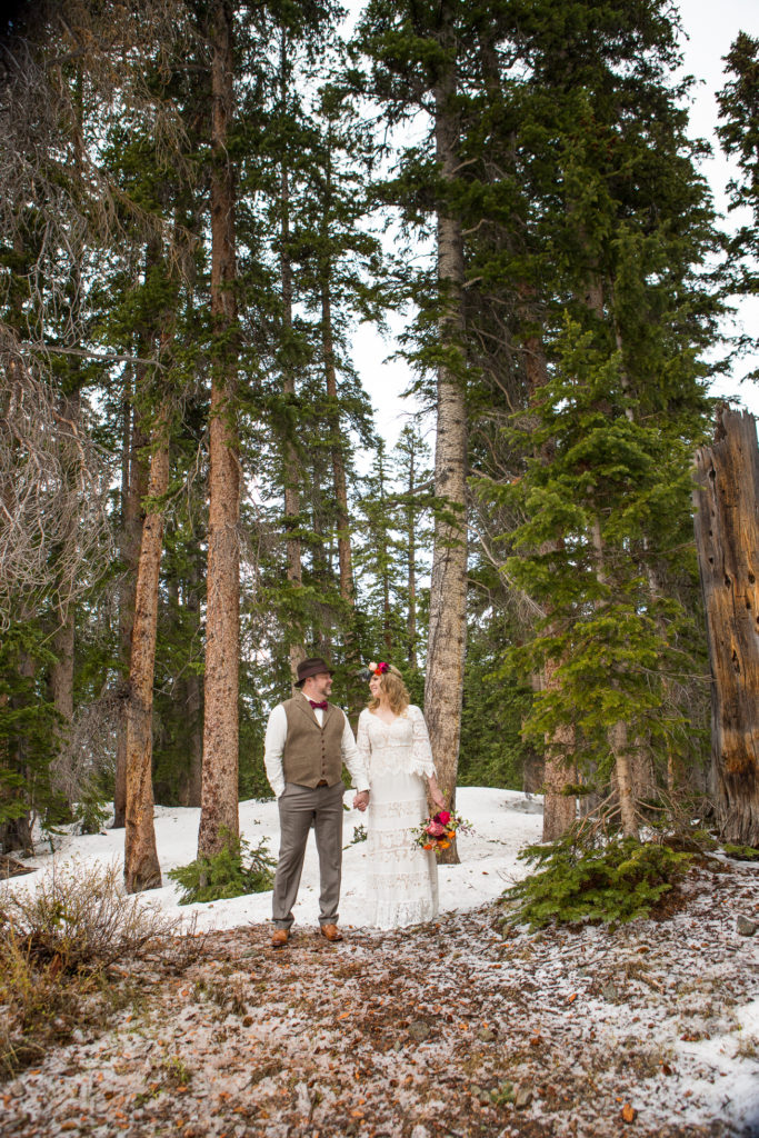 Telluride wedding couple poses in the woods at Alta Lakes Observatory 