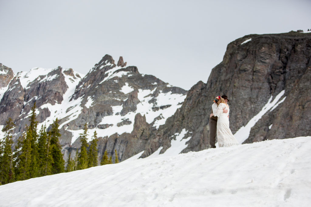 wedding images with the snow capped mountains of Telluride behind the bride and groom at the Observatory