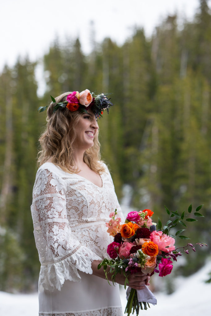 boho bride and bouquet In the snow in Telluride