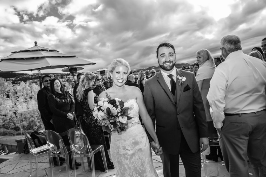 black and white image of couple during their recessional.