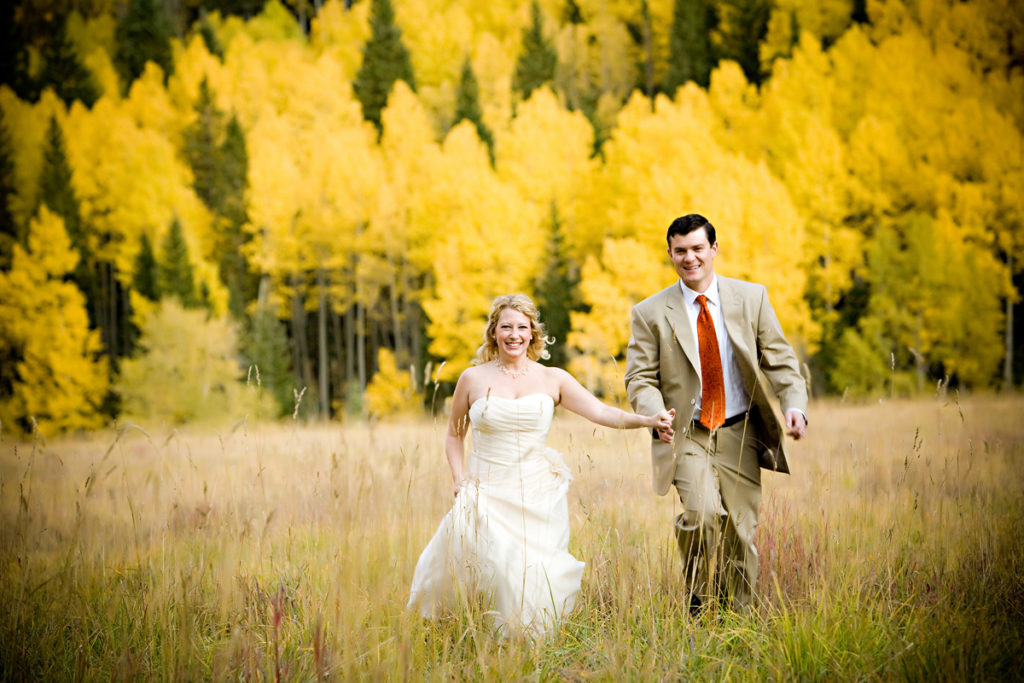 fall Telluride elopement couple walks hand in hand