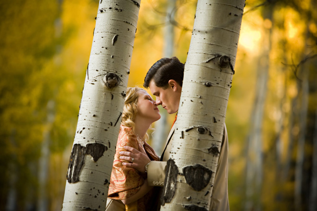 Couple embraces in the fall aspen trees in Telluride, Colorado