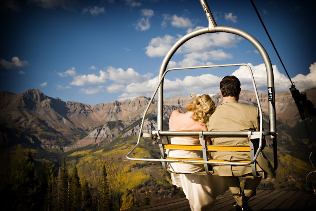 couple in Telluride, colorado on chair lift in the fall 