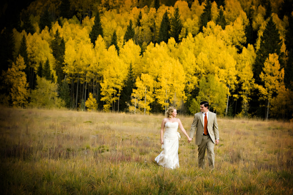fall Telluride elopement couple walks hand in hand