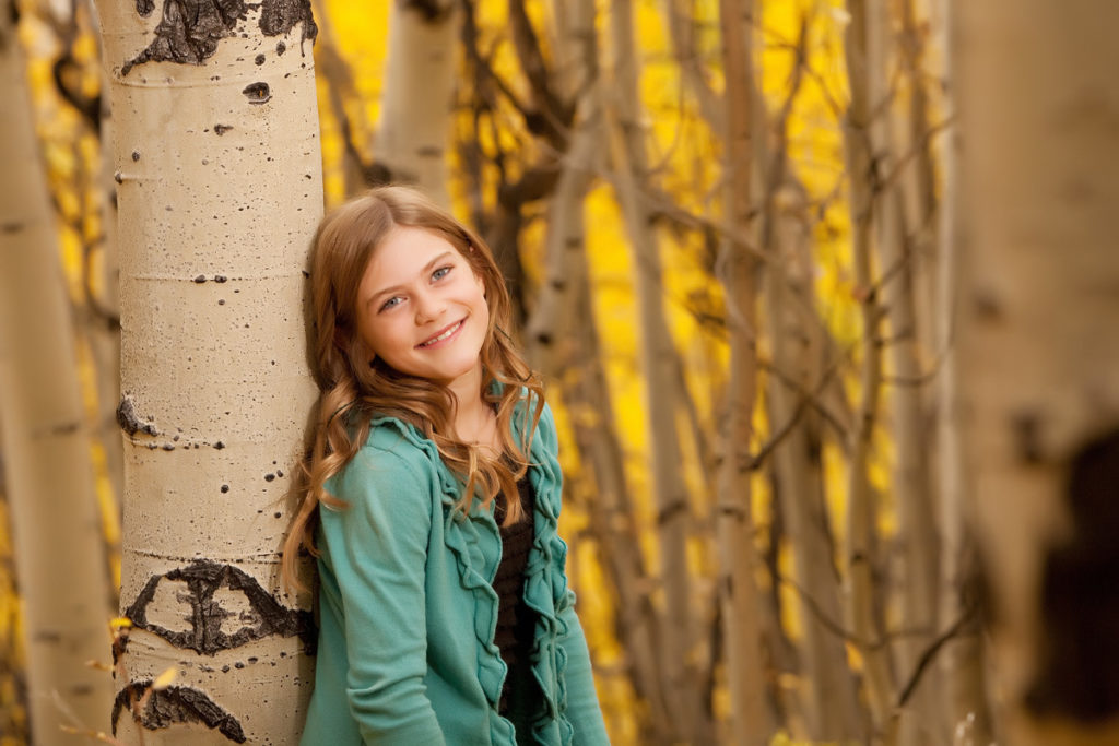 kid in the aspen trees in Telluride Colorado 