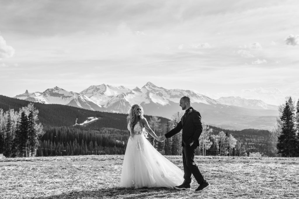Bride and groom at San Sophia Overlook with Mount Wilson in the back ground in Telluride, Colorado.
