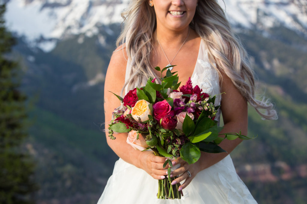 bride and her bouquet by bridal veil floral