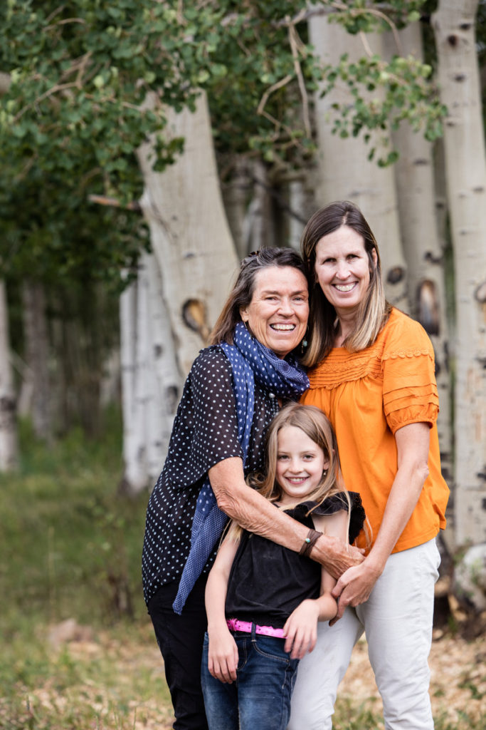 three generations embrace during their telluride family portrait session wilson mesa