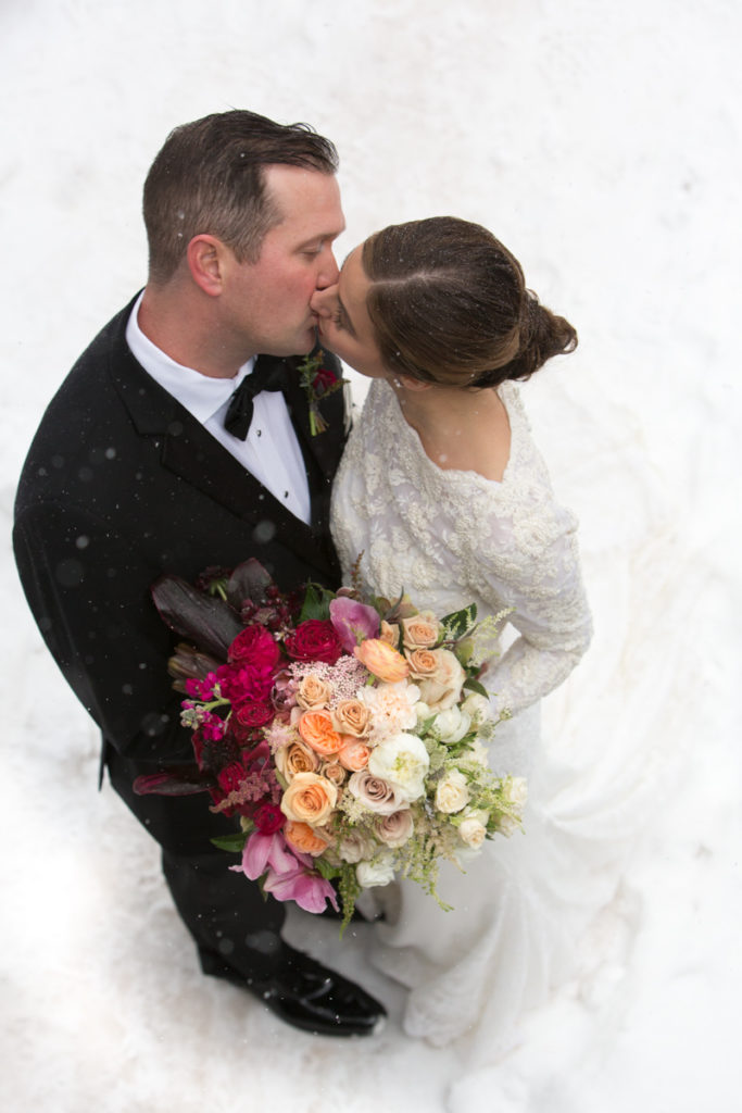 winter Telluride Peaks Wedding couple kisses