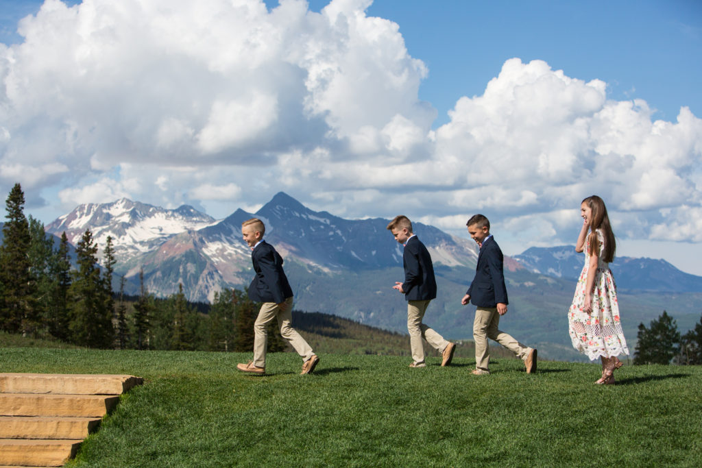 kids walking during the processional at San Sophia Overlook with mount wilson in the background