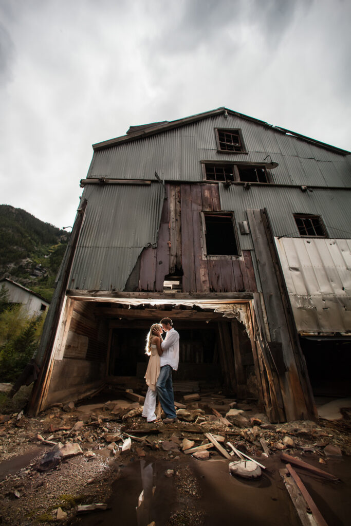 at the mines in Ophir, Colorado this engaged couple embraces.